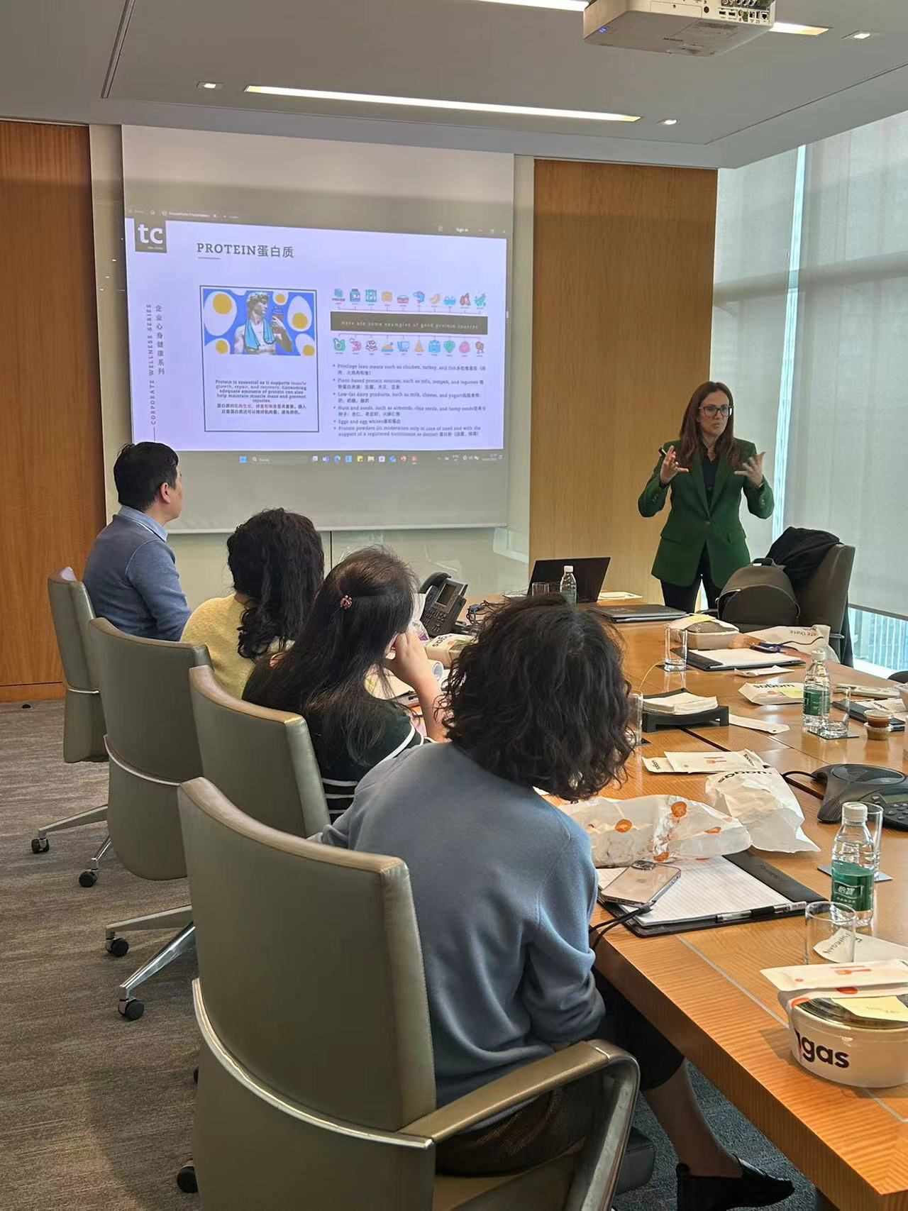 Dr. Sara Fenili delivering a corporate wellness seminar